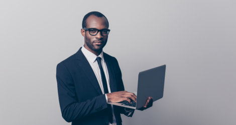 work professional man holding a laptop